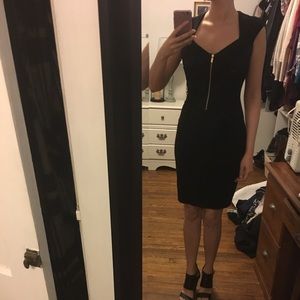 Black cache dress with gold zip